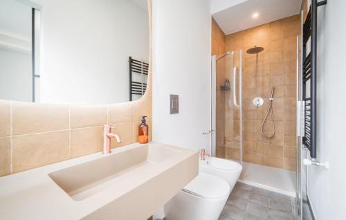 a bathroom with a sink and a toilet and a shower at Dimora Harmonia in Carini