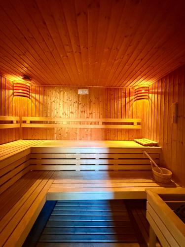 a large wooden sauna with a tub in it at BÉNI family wine farm in Cegléd
