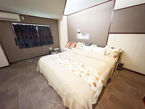 Una cama o camas en una habitación de ティアラ
