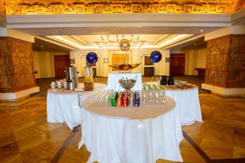 two tables in a large room with drinks on them at Barceló Karmina - All Inclusive in Manzanillo