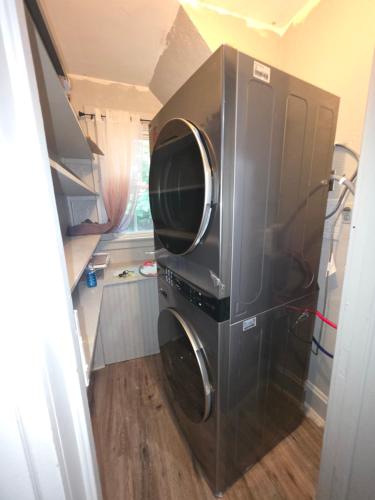 a washer and dryer in a small kitchen at downtown and secluded in Manchester