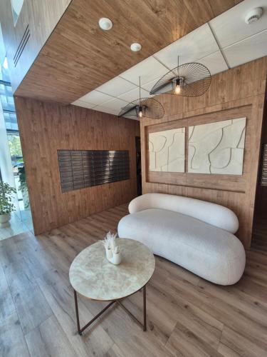 a bedroom with two beds and a table at RESORTLuxurySPA in Wrocław