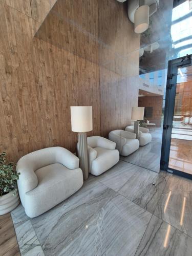 a living room with two chairs and two lamps at RESORTLuxurySPA in Wrocław