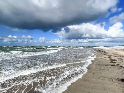 a view of the ocean from the beach at 12 person holiday home in Hundested-By Traum in Hundested