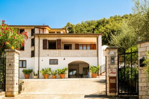 a house with a gate in front of it at Villa Flora in Perugia