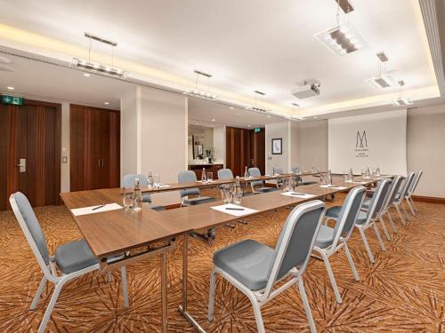 a large conference room with a long table and chairs at The Artisan Hotel Istanbul - MGallery Collection in Istanbul