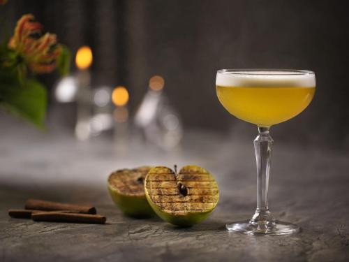 a glass of wine and two halves of an avocado at Sofitel Wellington in Wellington