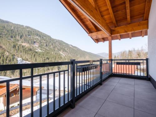 a balcony with a view of the mountains at Roßbrand und Tauern-Blick in Untertauern