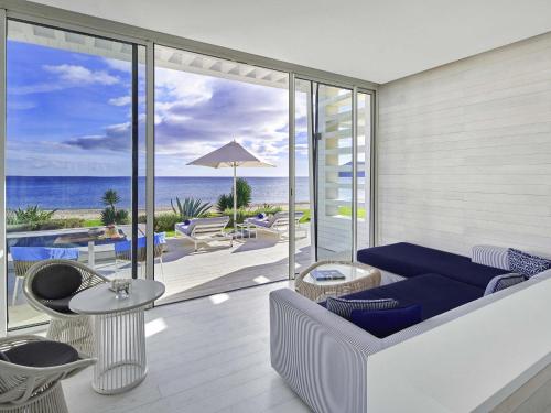 a living room with a view of the ocean at Sofitel Tamuda Bay Beach And Spa in M'diq
