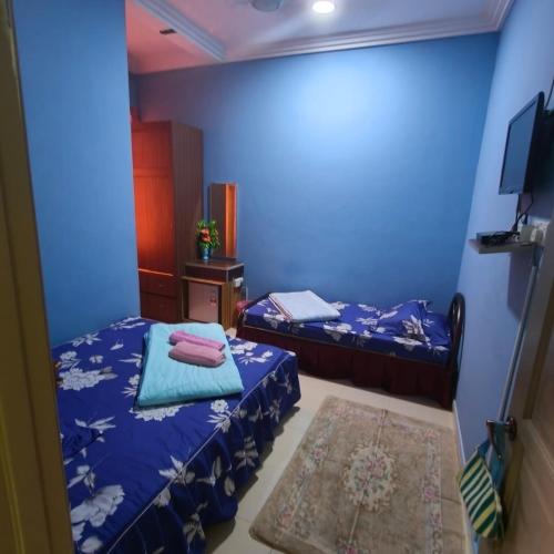 Кровать или кровати в номере Quddus Inn villa