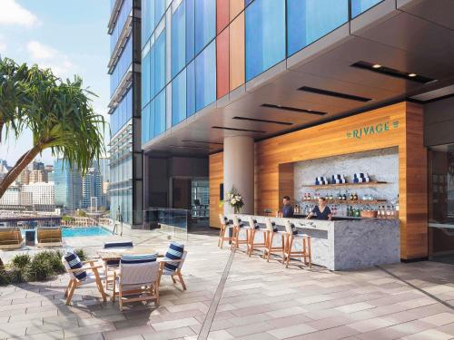 a restaurant with a bar on the side of a building at Sofitel Sydney Darling Harbour in Sydney