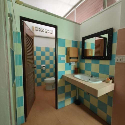 a bathroom with a sink and a toilet at New! MATA Garden resort Ao Nang in Ao Nang Beach