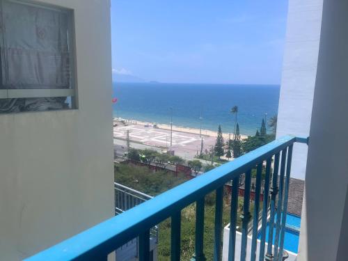 a balcony with a view of the ocean at Pavillon Garden Hotel in Nha Trang
