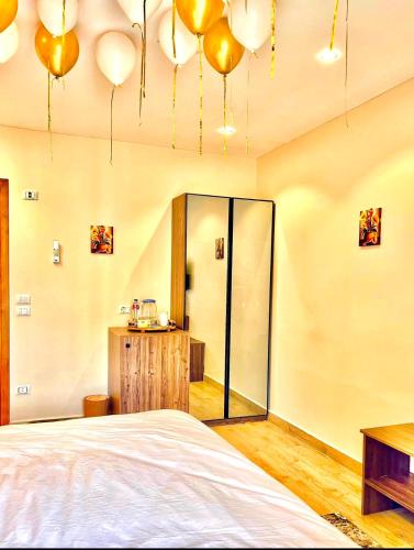 a bedroom with a bed and a glass wall at Amon Pyramids View Inn in Cairo