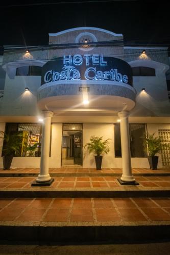 a hotel costa colica is lit up at night at Hotel Costa Caribe BAQ in Barranquilla