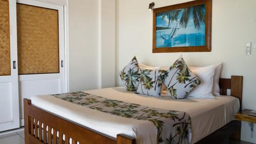 Una cama o camas en una habitación de Mokusiga Villas