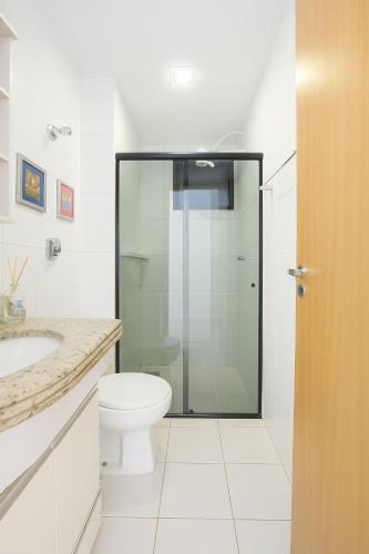 a bathroom with a toilet and a glass shower at Rent in the Heart of COP 30 Belém in Belém