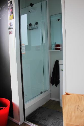 a glass shower in a room with a box at Night Sky Magic in Olive Grove in Gladstone