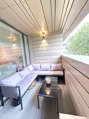 a sauna with a couch and a table at Quiet Hideaway in London
