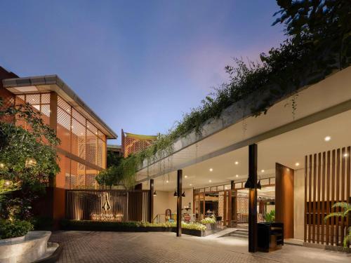 an external view of a house with a courtyard at Avista Grande Phuket Karon - MGallery in Karon Beach
