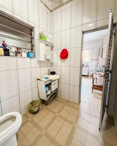a bathroom with a toilet and a sink at Espaço laser soberana in Guarulhos