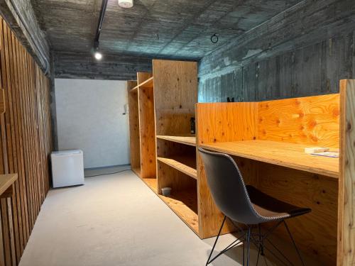 a room with a desk and a chair in it at RePORTHOTEL in Yaizu