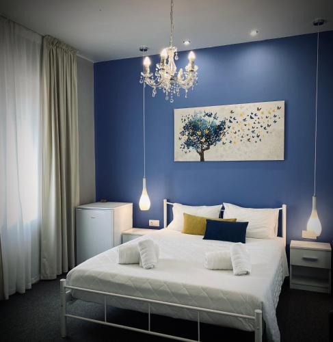 Postel nebo postele na pokoji v ubytování APOLLONIO Suites