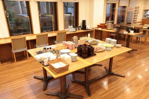 a table with food on it in a room at KKR Hotel Nakameguro in Tokyo