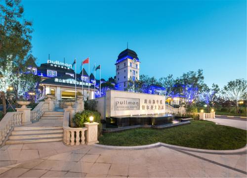 a view of a building at night at Pullman Tangshan in Tangshan