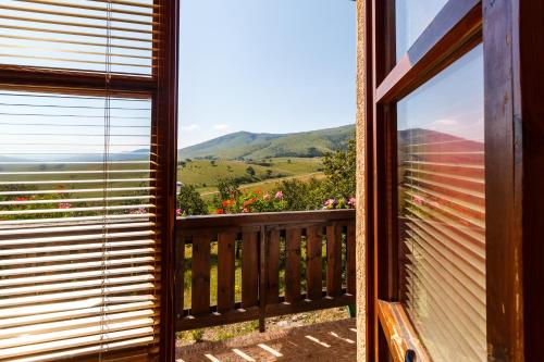 a balcony with a view of the mountains at Guest House Vila Djokic in Zlatibor