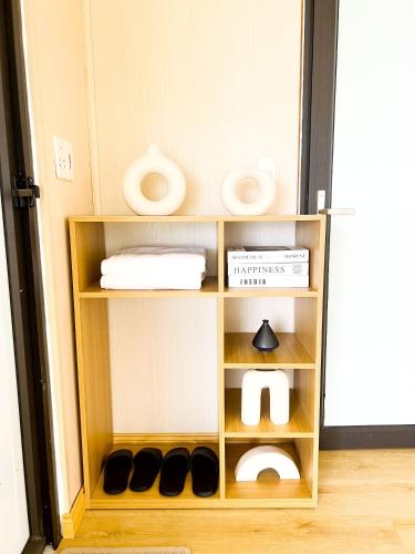 a shelf in a room with shoes on it at Dreamy Homestay Tam Đảo in Tam Ðảo
