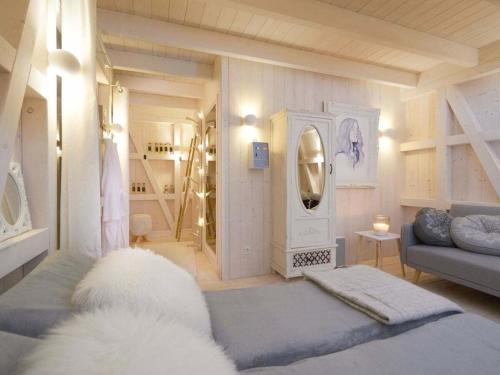 a living room with a couch and a mirror at Holiday home in Mosel with 3 bedrooms in Treis-Karden