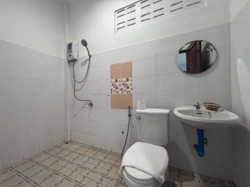 a bathroom with a toilet and a sink at Aioun At Amphawa in Ban Bang Khan Taek (1)