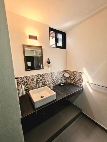a bathroom with a sink and a mirror at S05 SUITE DOBLE CAMA MATRIMONIAL Premium Frente al TEC CEM con Cocineta WiFi Balcón Parking Terraza in Mexico City