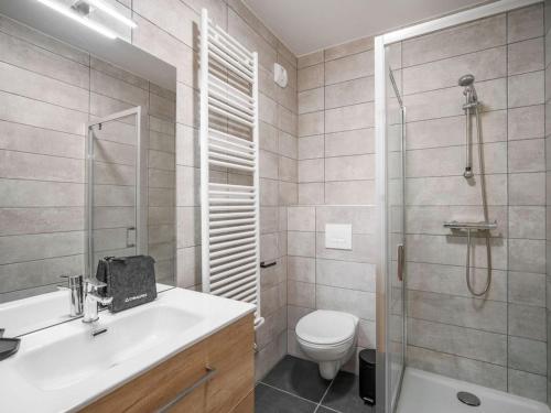 a bathroom with a sink and a toilet and a shower at Appartement T2 confort 4 pers., parking inclus - FR-1-809-29 in Les Saisies