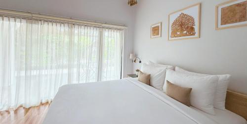 Ένα ή περισσότερα κρεβάτια σε δωμάτιο στο Moringa Tree Maison