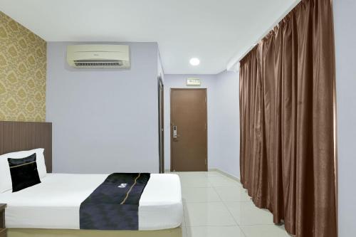 Katil atau katil-katil dalam bilik di Hotel O Hotel Hamilas