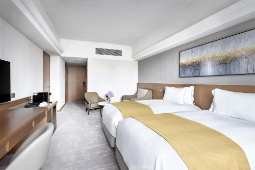 Postel nebo postele na pokoji v ubytování Hopewell Hotel