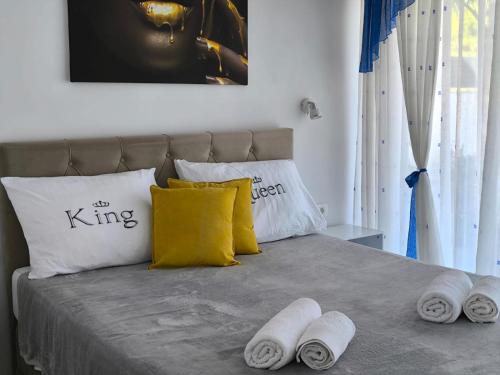 a bedroom with a bed with towels on it at Villa S in Vir