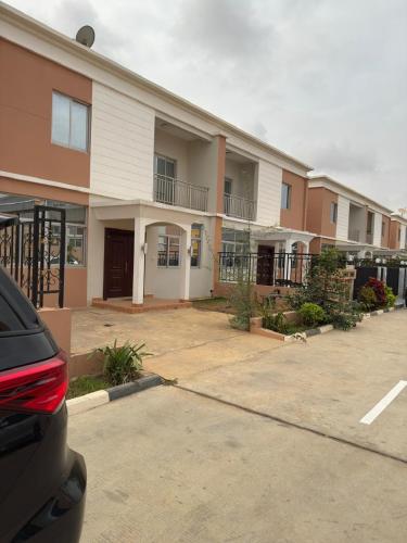 a parking lot in front of a building at Cassoma Home Angola in Belas
