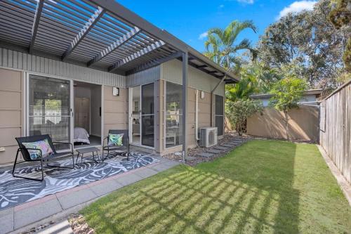 an image of a backyard with a house at Private Poolside Villa in Urangan