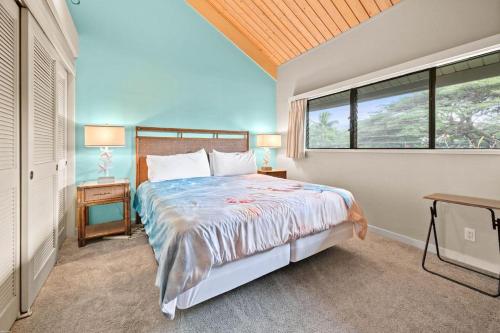 a bedroom with a bed and a large window at Kahana Village 9 · KHV 9 2BR Oceanfront Condo w Panoramic Maui in Kahana