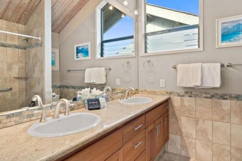 a bathroom with two sinks and a large mirror at Kahana Village 9 · KHV 9 2BR Oceanfront Condo w Panoramic Maui in Kahana
