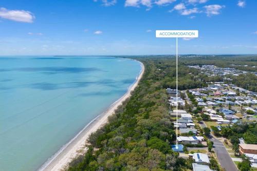 an aerial view of a beach with a sign that reads evacuation at Sol Sanctuary- Beachfront in Toogoom