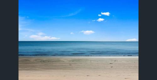 a view of the ocean from the beach at Sol Sanctuary- Beachfront in Toogoom