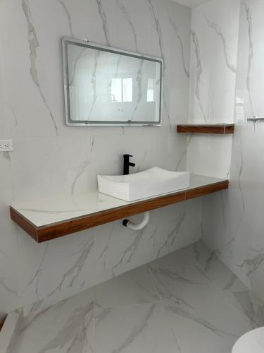 a bathroom with a sink and a mirror at Mar de Calafia 1 in Divisadero