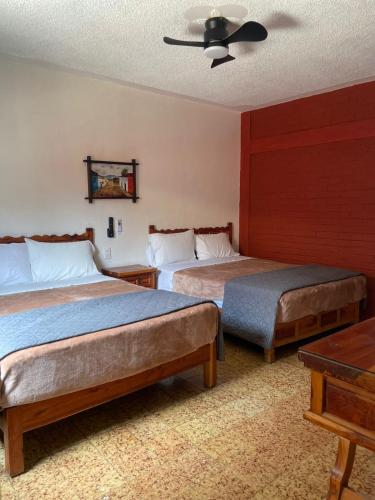 Ένα ή περισσότερα κρεβάτια σε δωμάτιο στο Hotel Bungalows La Era