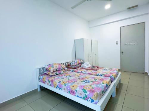a bedroom with a bed in a white room at KLIA Sepang Salak Dream Retreat Homestay in Sepang