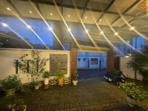 an indoor courtyard with potted plants in a building at AnAn VILLA in Khu Chi Lăng