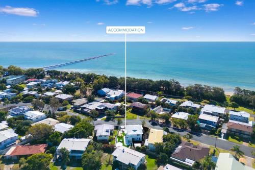 an aerial view of a suburb with houses and a street sign at The Springs Villa 2 in Urangan